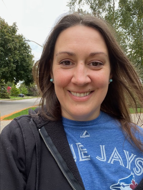 Harmony (Owner) smiling at camera and enjoying a walk on a local street. 